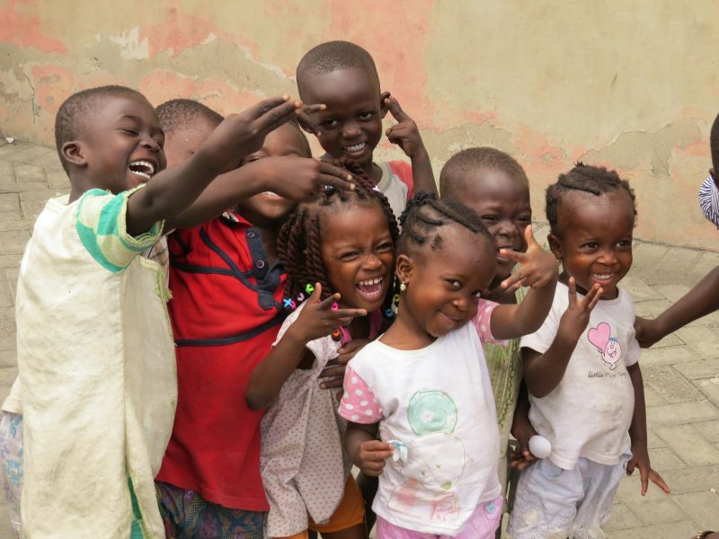 Photo by Yoel Winkler group of people standing near brown concrete wall during daytime